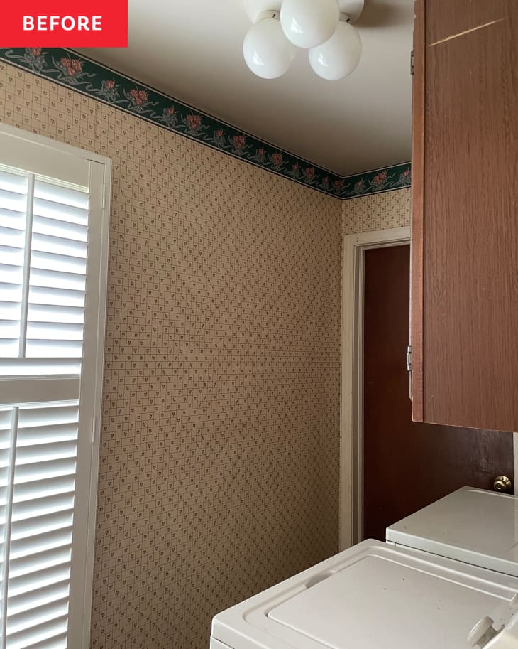 Laundry room with floral wallpaper border, white shutters, and a ceiling light fixture.