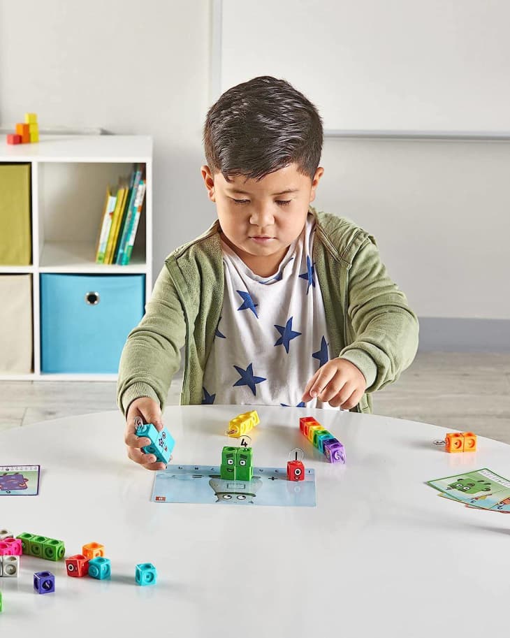 boy playing with buildable colorful tiles