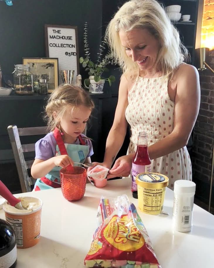 mother and daughter making ice cream sundaes