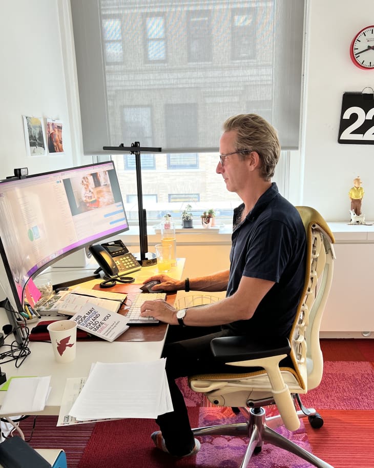 Maxwell at his desk writing his column