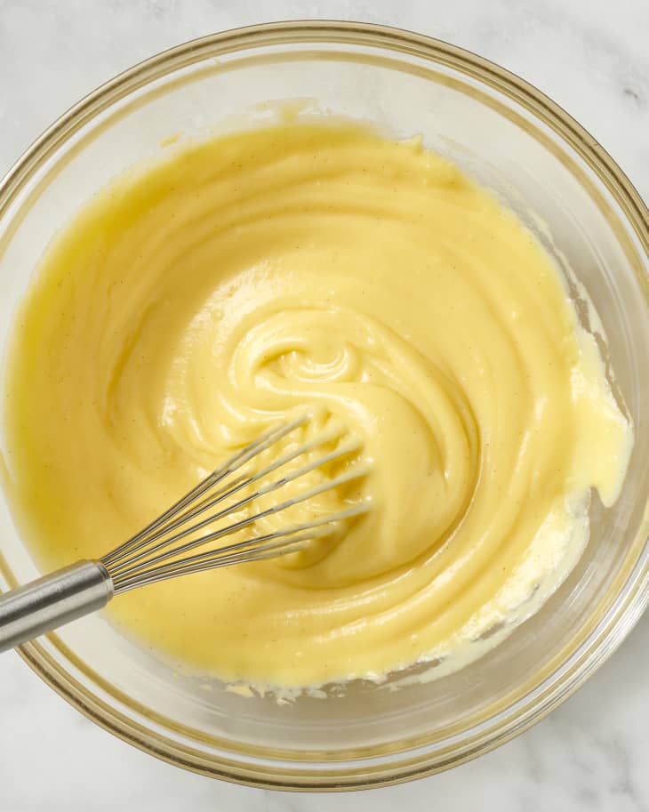 pastry cream in a bowl with a whisk