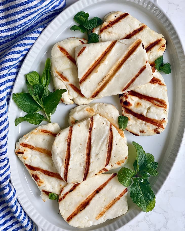 A plate of grilled halloumi and basil