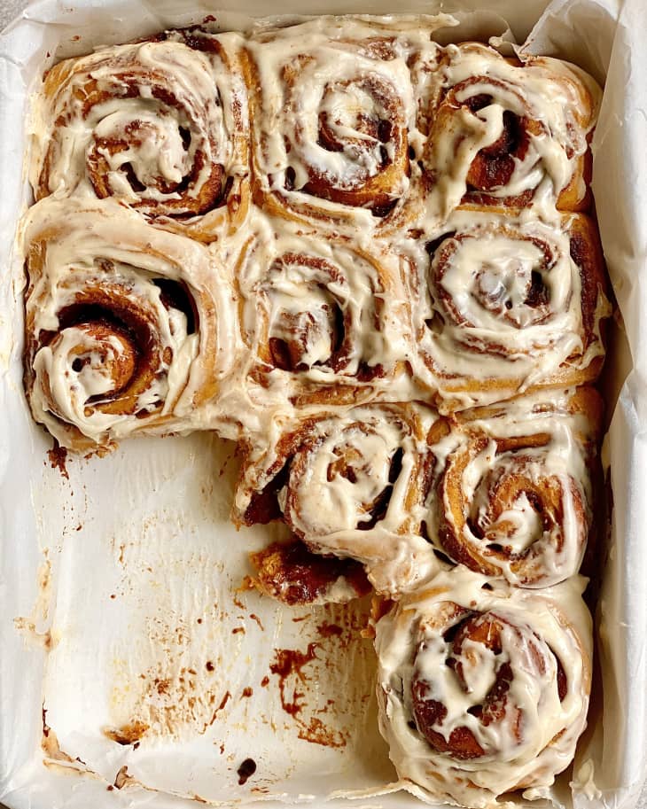 Pumpkin cinnamon rolls in a pan.