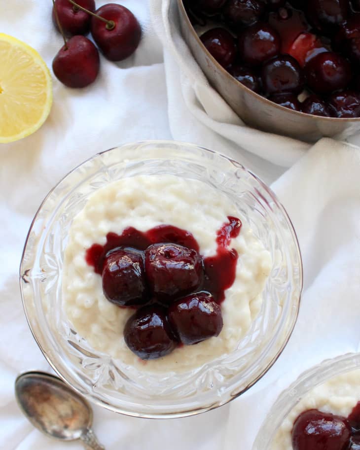 rice pudding with cherries on a bowl on linen