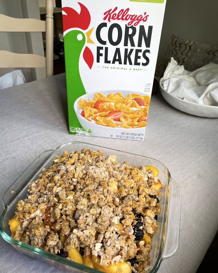 corn flakes in baking dish next to box of corn flakes