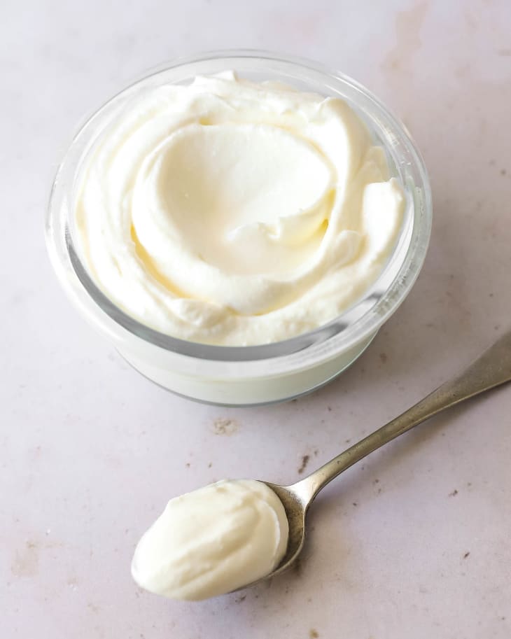 Spoonful and bowl of sour cream