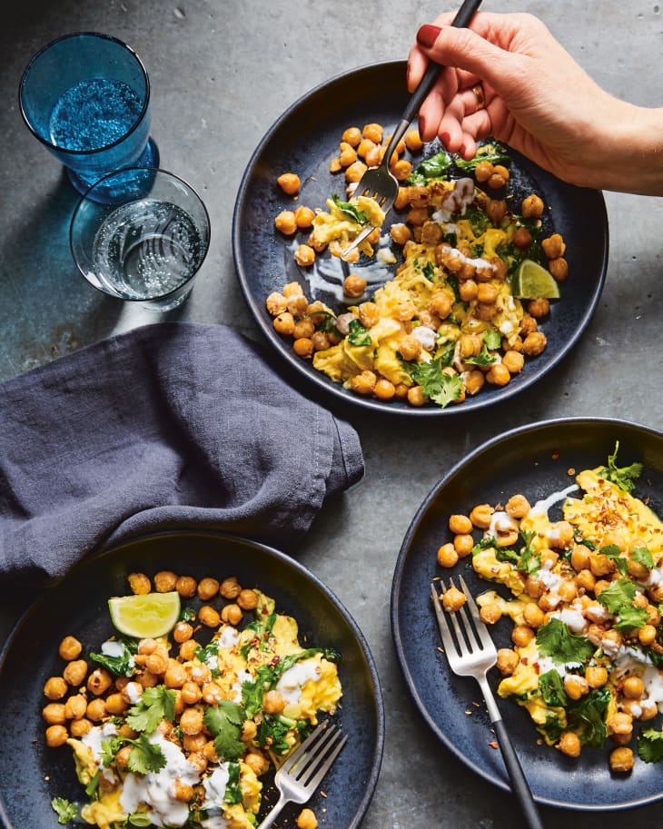 Photograph of Fried Chickpeas and Scrambled Eggs with Garlicky Greens and Spicy Yogurt.