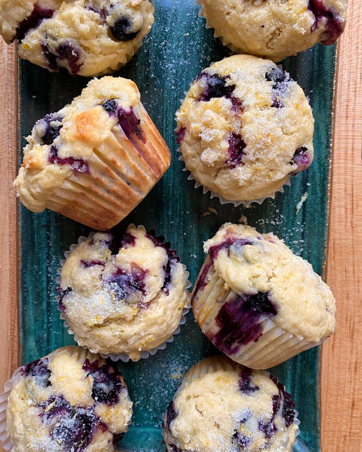 close-up of blueberry muffins on blue-green tray
