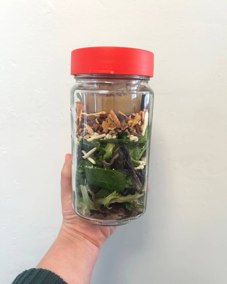 Salad in Pyrex storage container topped with lid.