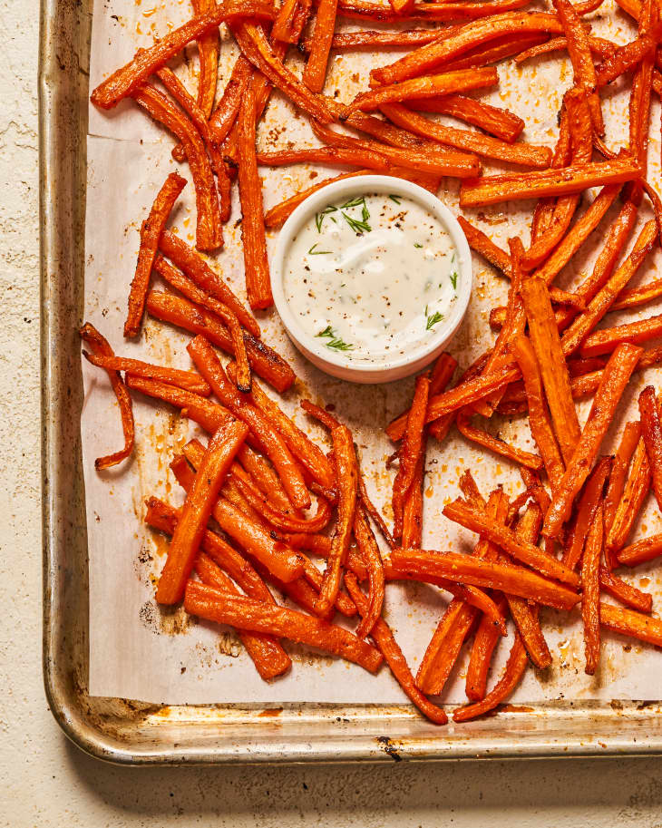 Homemade carrot fries on sheet pan with dip