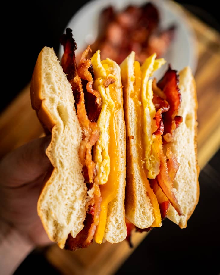 Flour coated bacon, egg and cheese bagel sandwich.