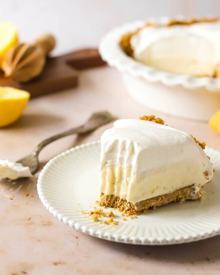 Slice of lemon icebox cake with bite out.