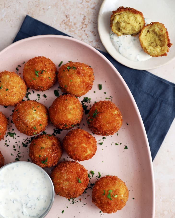 Deep-fried Matzo Balls on plate with side of herby ranch dressing