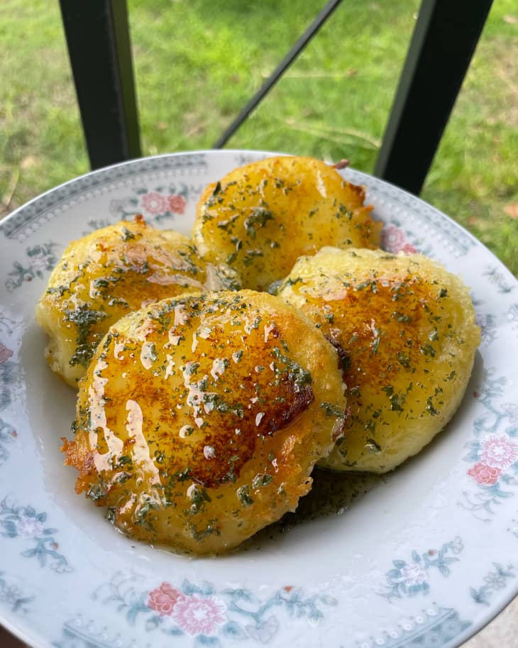 Honey glazed cheesy potato pancakes cooked on a plate.