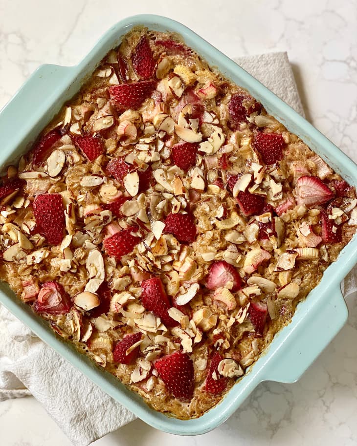 Whole strawberry rhubarb baked oatmeal in baking dish.