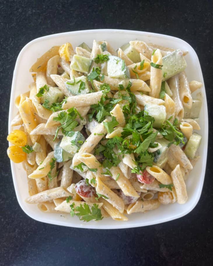 penne pasta salad in a square bowl