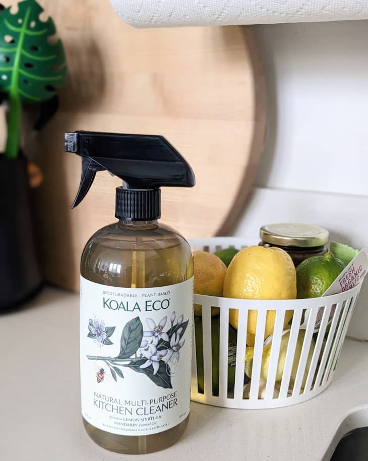 Koala Eco Lemon Myrtle & Mandarin Essential Oil multi-purpose cleaner spray bottle on kitchen countertop.