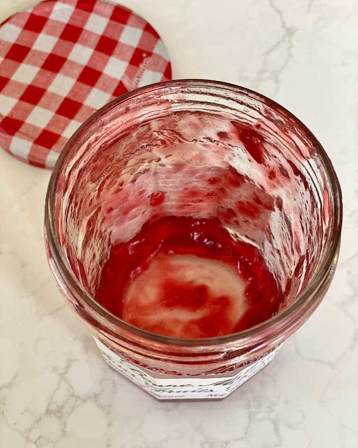 Nearly empty jam jar.