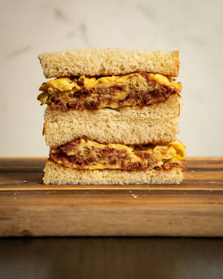 Hong Kong scrambled egg sandwich sliced in half and stacked.