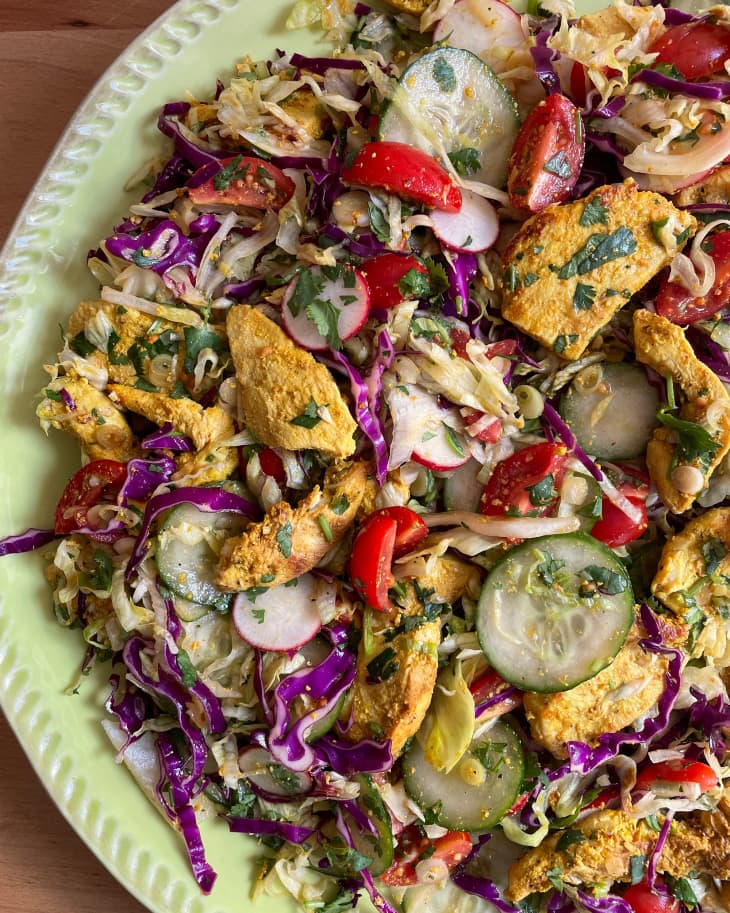 Close up of plated tandoori chicken salad.