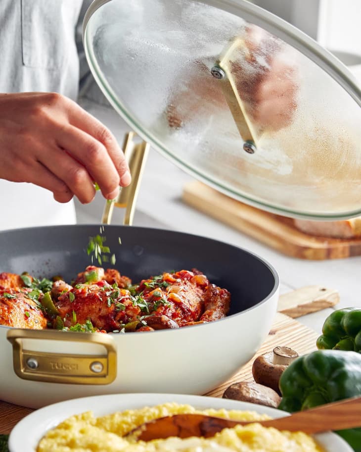 white ceramic saute pan with glass lid and meatballs cooking