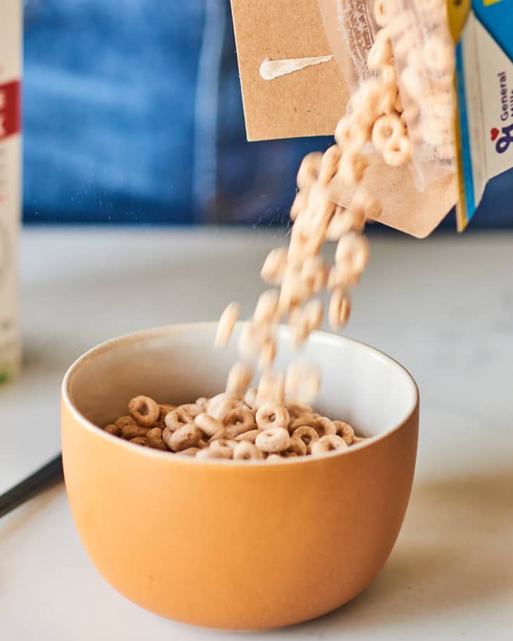 Cereal being poured into bowl.