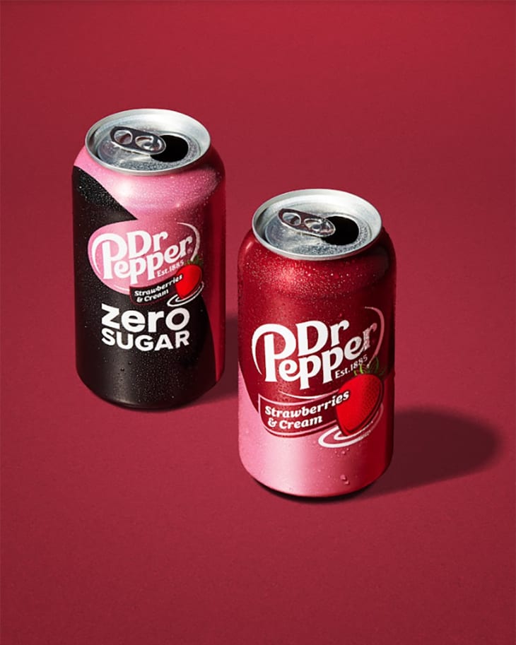 2 cans of Dr. Pepper on red background. One is Dr. Pepper Zero Sugar, and the other is Dr. Pepper Strawberries &amp; Cream