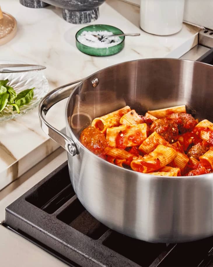 Caraway Stainless Steel Dutch oven on stove with rigatoni