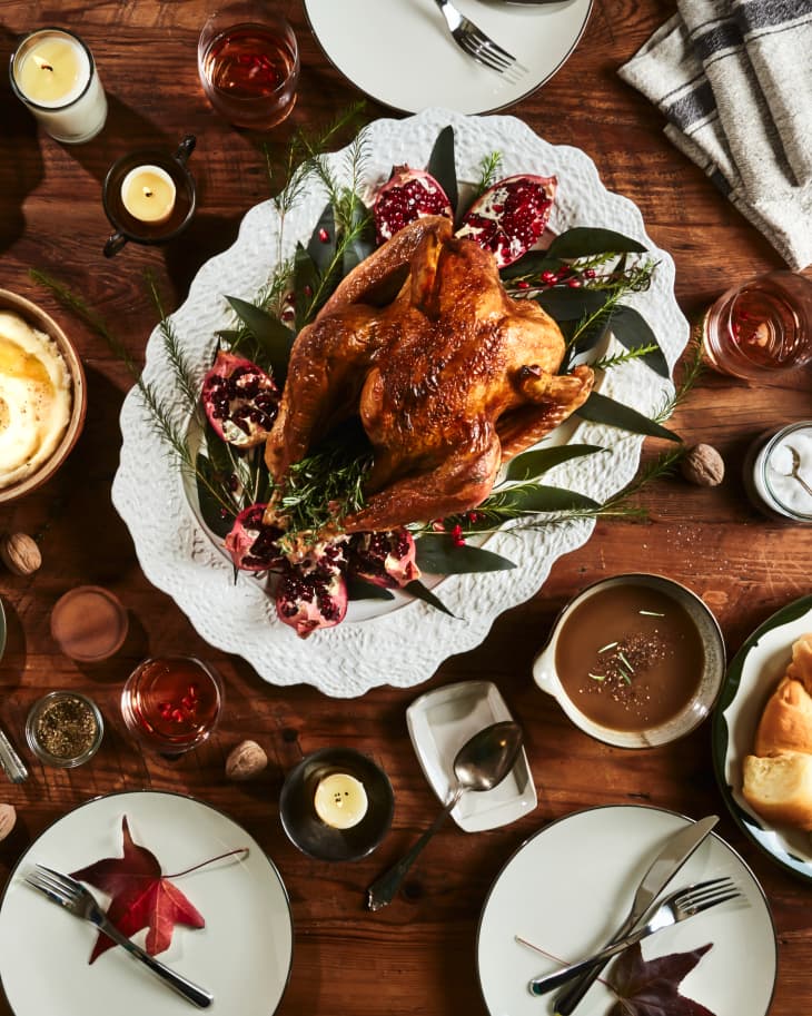 https://cdn.apartmenttherapy.info/image/upload/f_auto,q_auto:eco,c_fill,g_center,w_730,h_913/k%2FPhoto%2FIn-House%20Stock%2FThanksgiving%2FKitchn_Holiday_Table-2-cropped