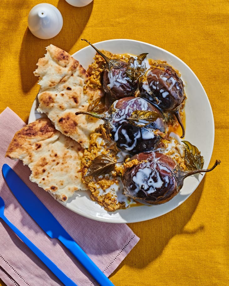 eggplant on pita covered in sauce