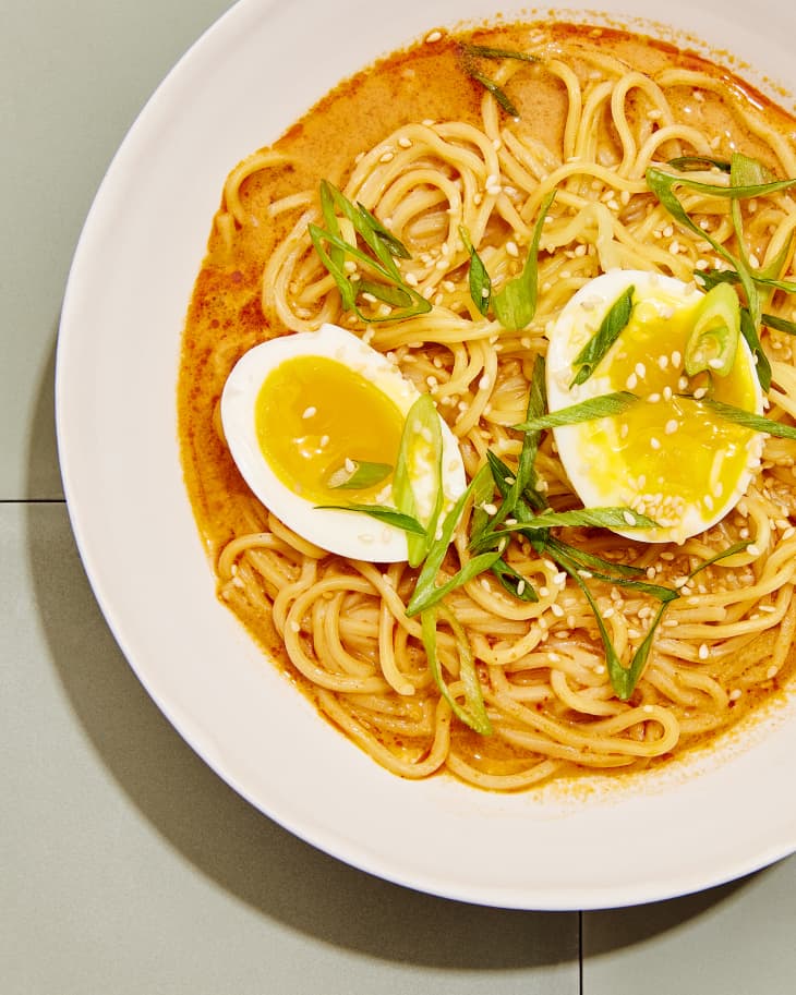 Bowl of Sun Noodle Ramen with an egg, green onions