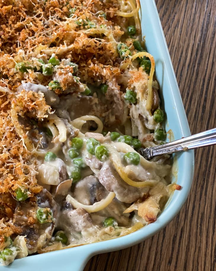 Chicken Tetrazzini (baked spaghetti with peas, chicken and mushroom in a creamy sauce) in a pan