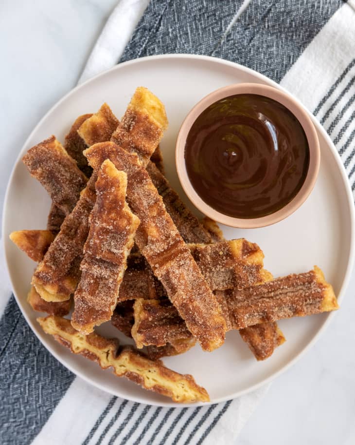 churro waffles, cut into strips, with chocolate sauce on the side