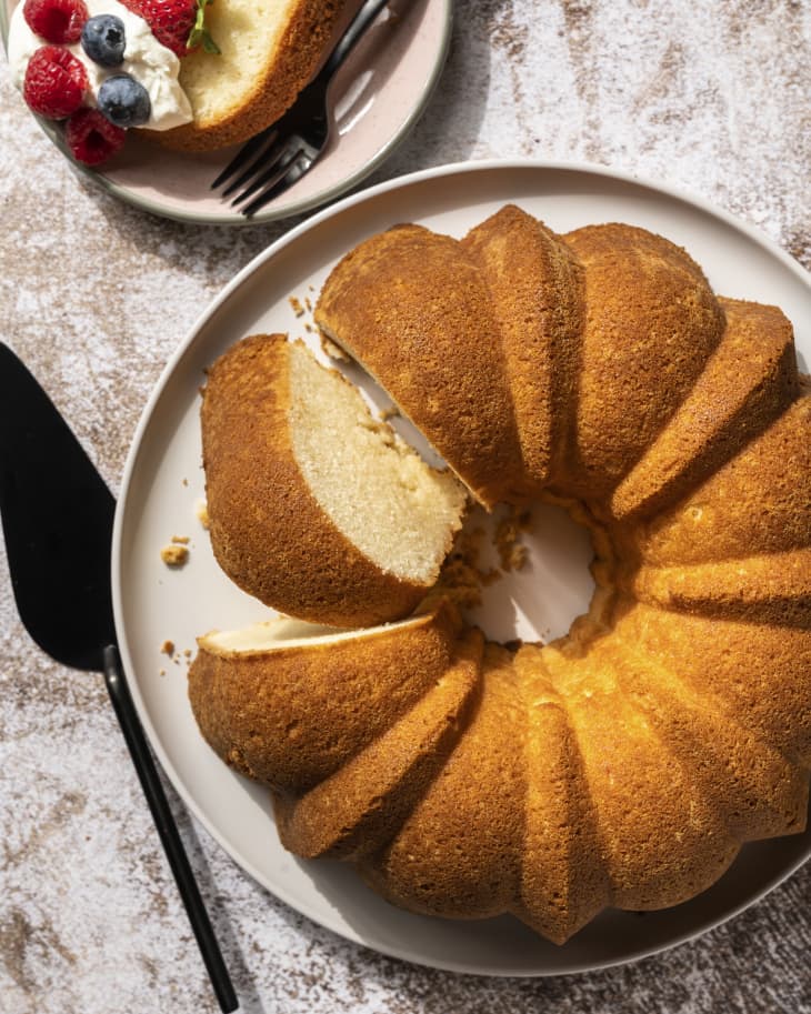 Cream cheese pound cake seen from the top, with one slice cut out