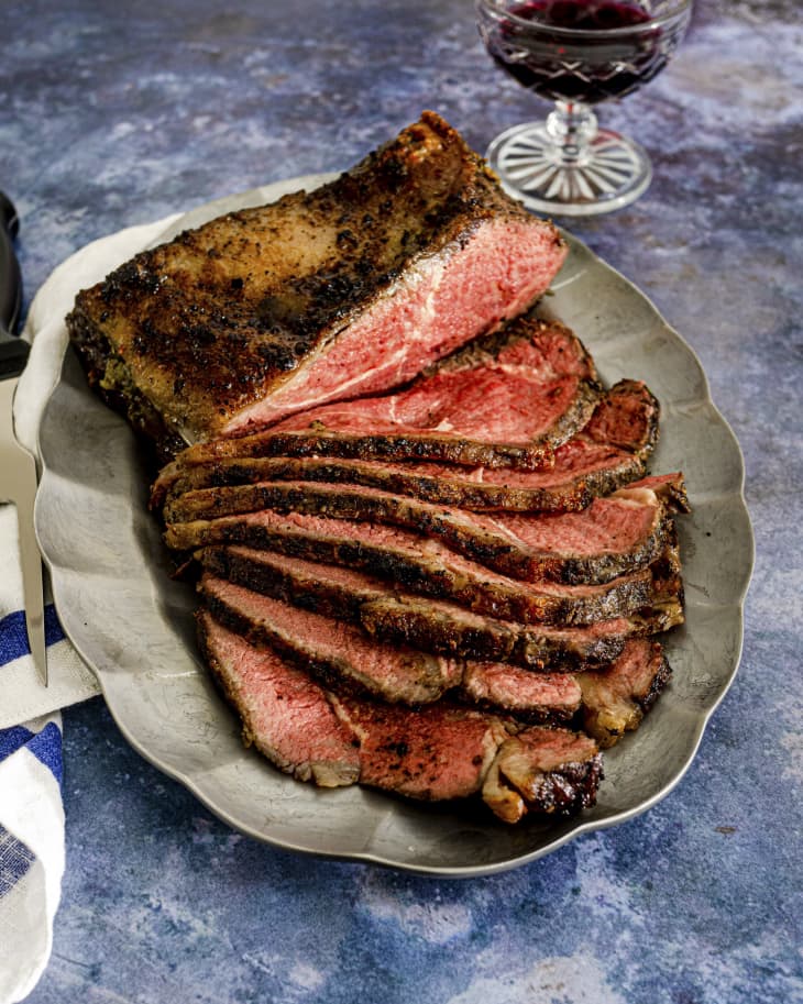 sliced roast beef cooked rare, on a platter.