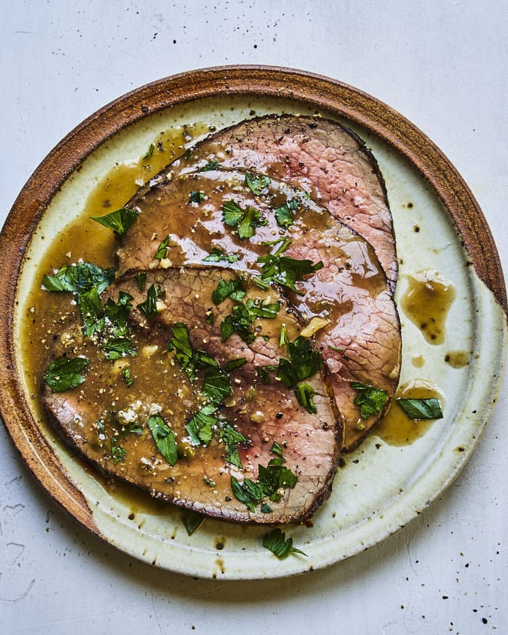 Eye of round roast sliced on a platter