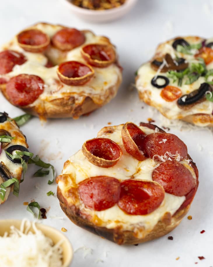open faced pizza bagels with various toppings