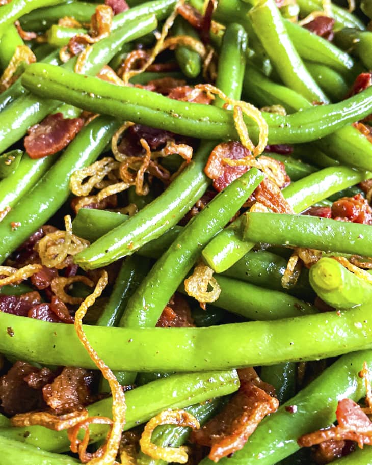 Green beans with bacon and skinny fried onion strips tossed together