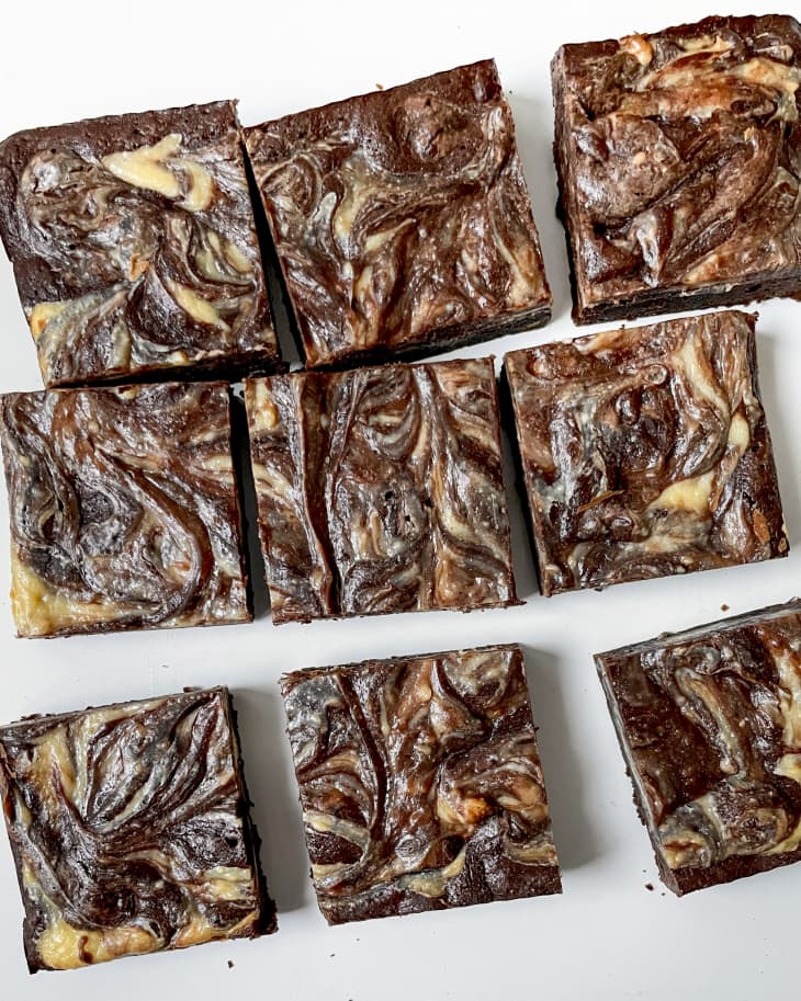 nine squares of black and white swirled brownie