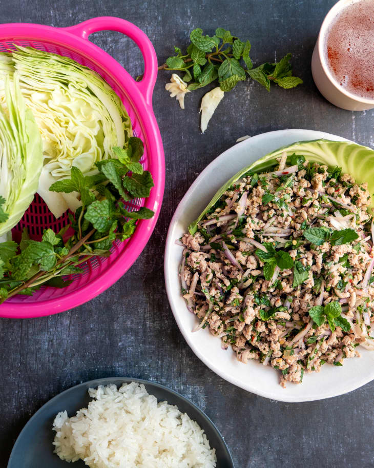 Larb is a meat salad consisting of ground meat, herbs, chilies, fish sauce, lime juice, and toasted ground rice