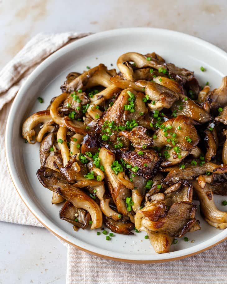 pan fried oyster mushrooms on a white plate