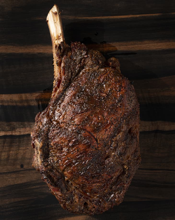 A whole, grilled, cowboy steak (a thick bone-in ribeye cut between the ribs)
