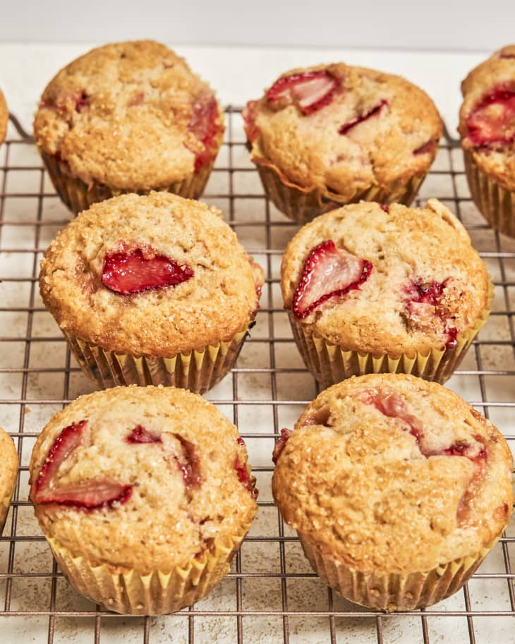 six strawberry muffins on a wire cooling rack