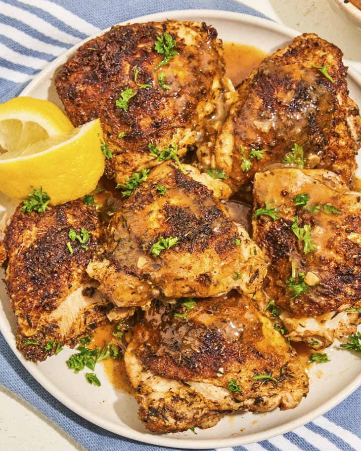 A photo of a plate with seasoned chicken thighs