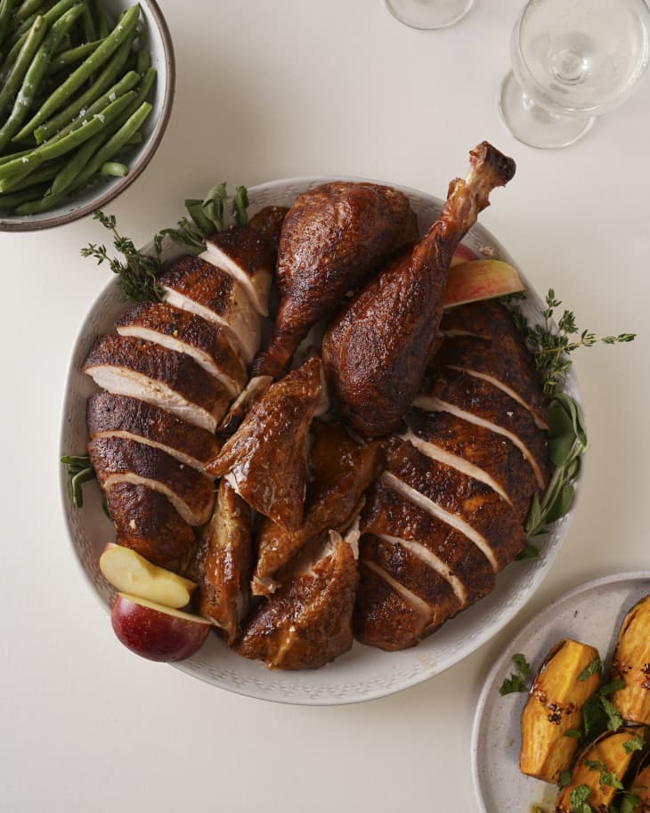 Marinated turkey legs in a disposable bake-ware pan close up on