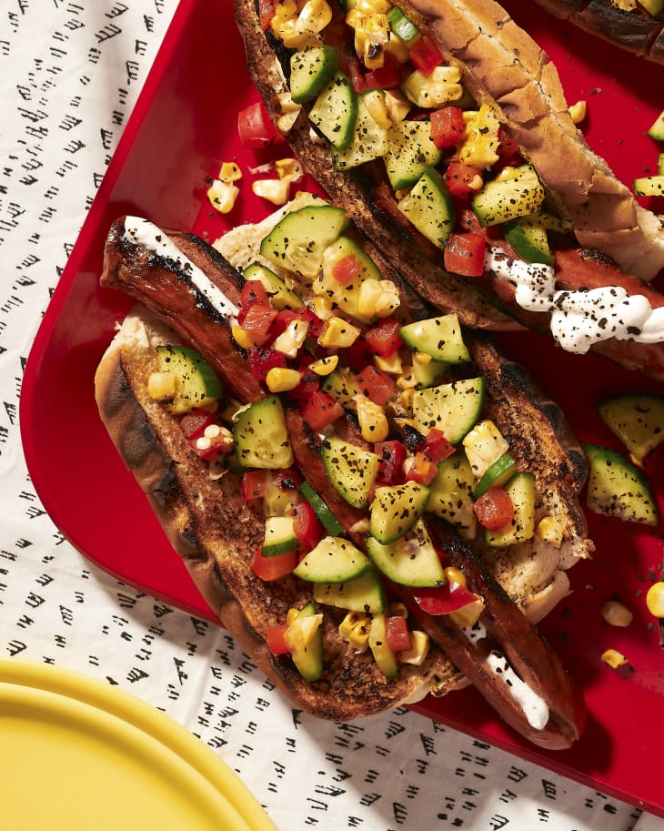Grilled hot dogs with various grilled veggie toppings
