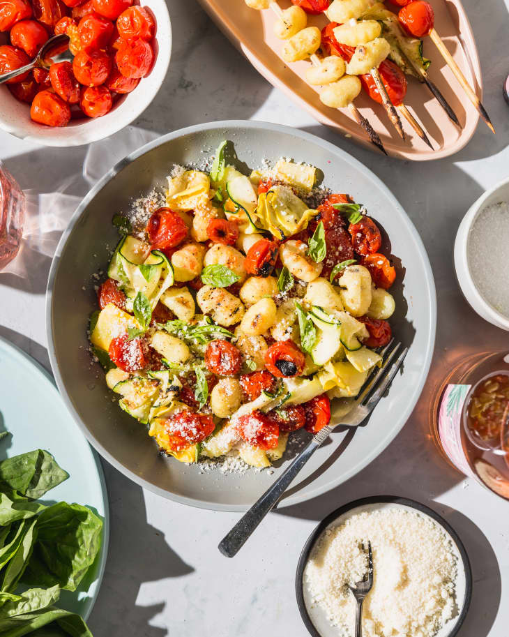 https://cdn.apartmenttherapy.info/image/upload/f_auto,q_auto:eco,c_fill,g_center,w_730,h_913/k%2FPhoto%2FRecipes%2F2019-05-Grilled-Gnocchi-with-Summer-Squash-Burst-Tomatoes%2FGrilledGnoccifinishedoption5