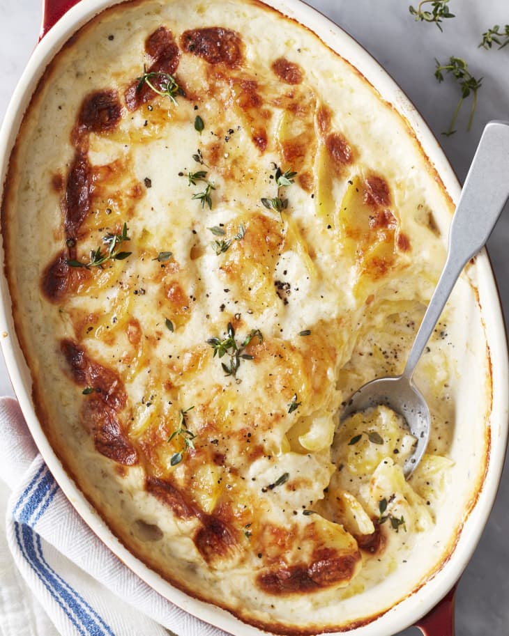 Dauphinoise potatoes in red casserole dish