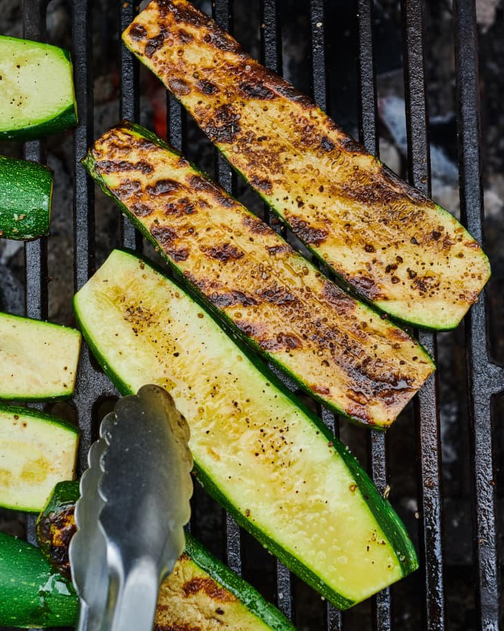 Turning zucchini on the grill