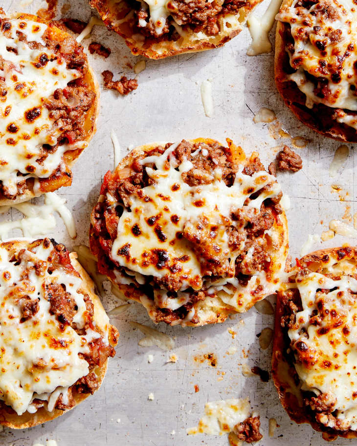 The open-face pizza burgers are baked on a sheet pan until the cheese browns and melts.